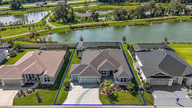 birds eye view of property with a water view