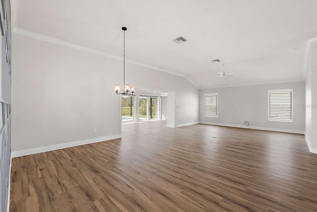 unfurnished living room with ceiling fan with notable chandelier, lofted ceiling, dark hardwood / wood-style floors, and ornamental molding