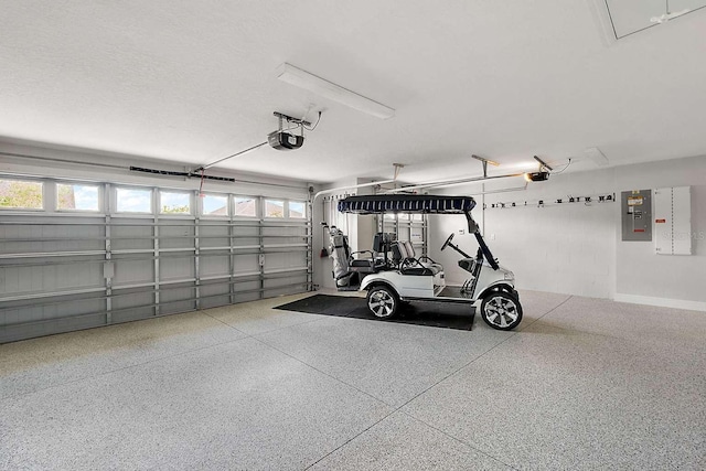 garage featuring a garage door opener and electric panel