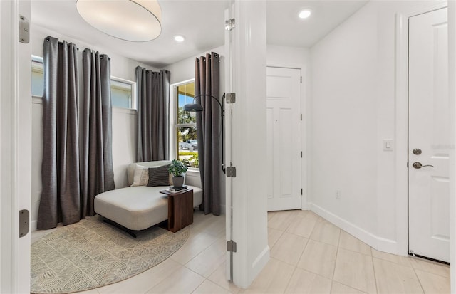 sitting room featuring light tile patterned floors