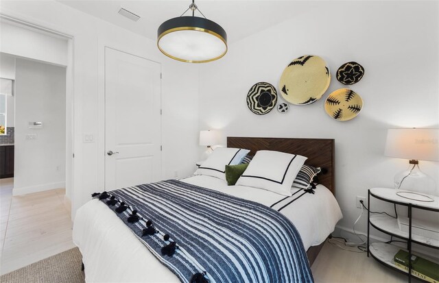 bedroom featuring light hardwood / wood-style floors