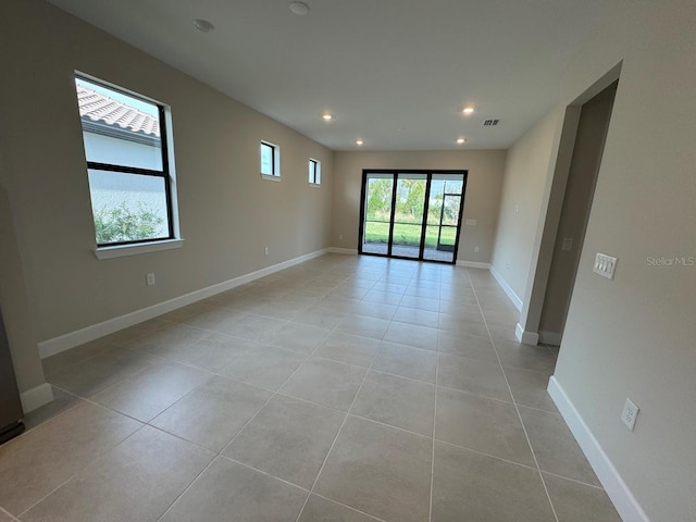 unfurnished room with light tile patterned floors