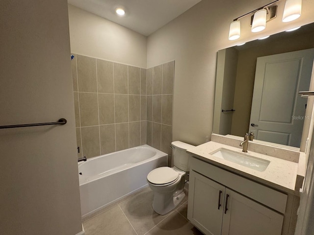 full bathroom with tile patterned flooring, vanity, toilet, and tiled shower / bath