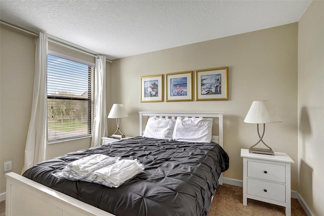 carpeted bedroom with a textured ceiling