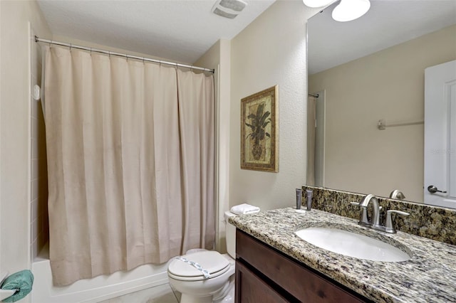 full bathroom with shower / tub combo, vanity, a textured ceiling, and toilet