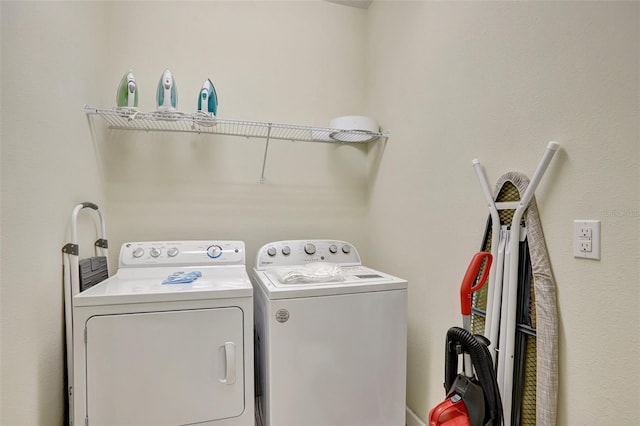 washroom featuring washer and dryer