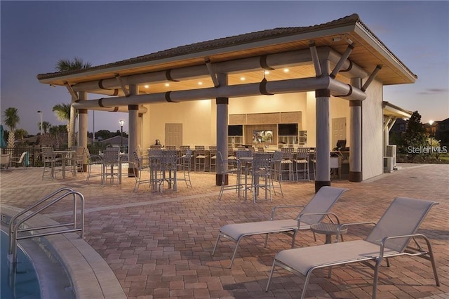 view of home's community with a patio area