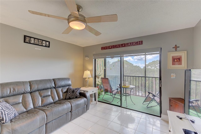 tiled living room with ceiling fan