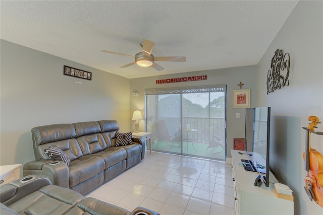 tiled living room with ceiling fan and a textured ceiling