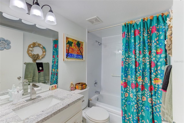 full bathroom featuring vanity, toilet, a textured ceiling, and shower / bath combo