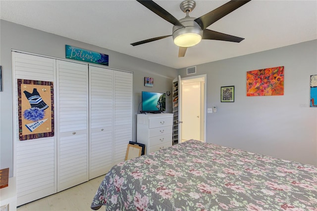 bedroom with a closet and ceiling fan