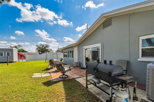 view of yard featuring a patio area and central AC unit