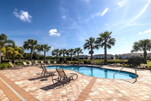 view of swimming pool with a patio area