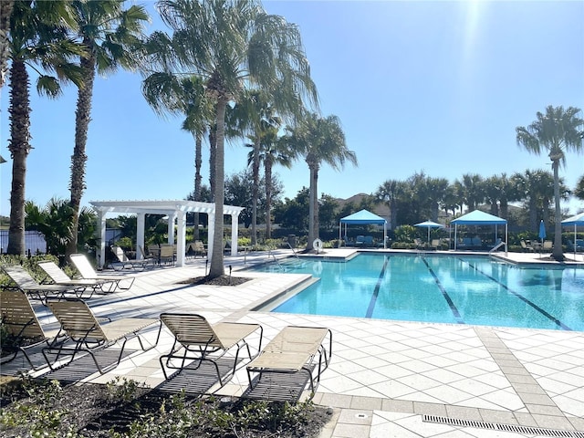 view of swimming pool with a pergola and a patio