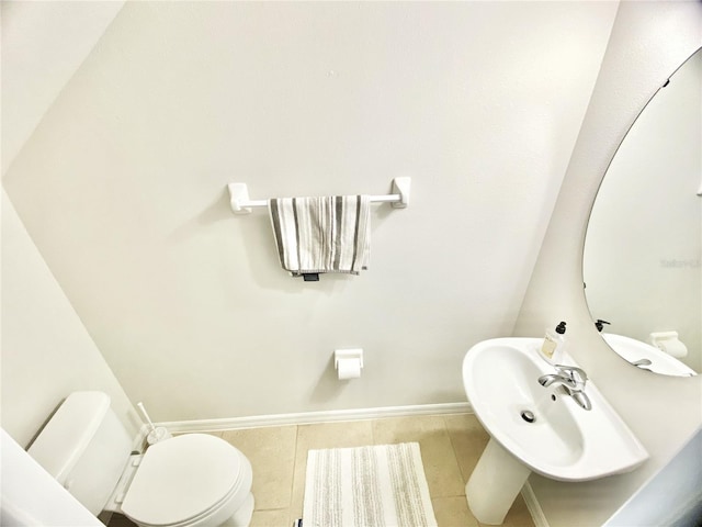 bathroom with tile patterned flooring and toilet