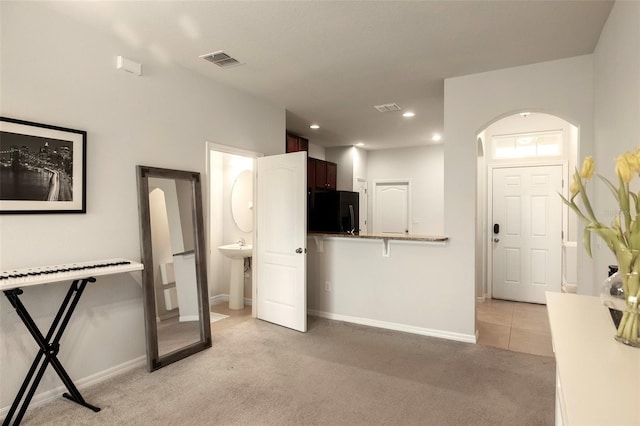 unfurnished living room with light carpet