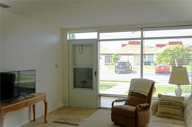 living room with light tile patterned flooring