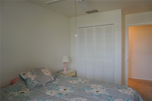 unfurnished bedroom with ceiling fan, carpet floors, and a closet