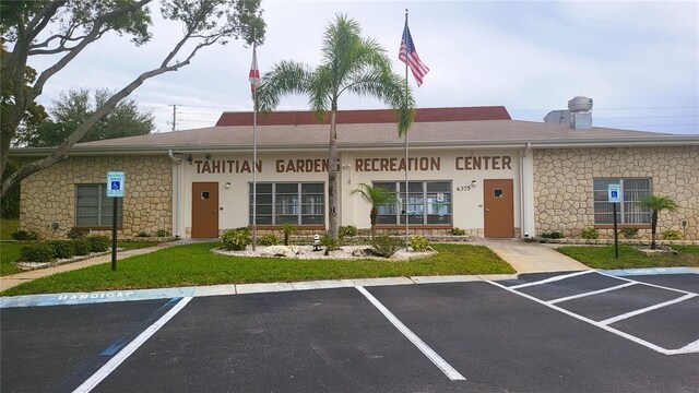 4338 Tahitian Gardens Cir Unit C, Holiday, FL 34691 - view of building exterior with uncovered parking