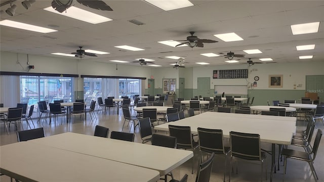 dining area featuring a drop ceiling