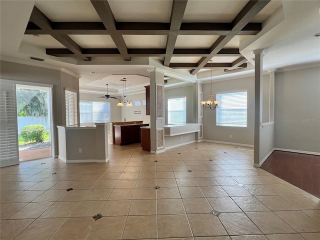 tiled foyer entrance with coffered ceiling, decorative columns, a wealth of natural light, and ornamental molding