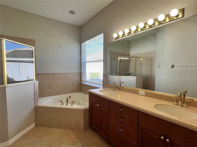 bathroom featuring shower with separate bathtub, tile patterned floors, and vanity