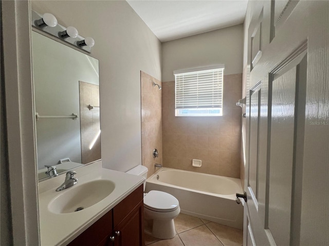 full bathroom featuring tiled shower / bath combo, tile patterned floors, vanity, and toilet