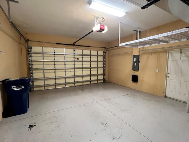 garage featuring a garage door opener and electric panel