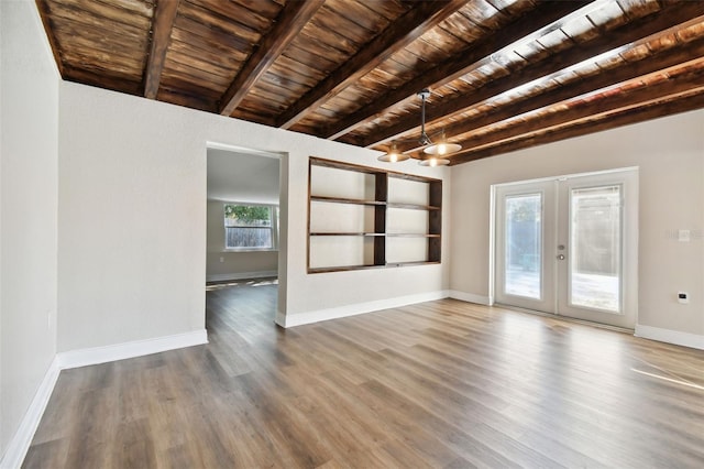 unfurnished living room with french doors, beam ceiling, wooden ceiling, a chandelier, and hardwood / wood-style floors