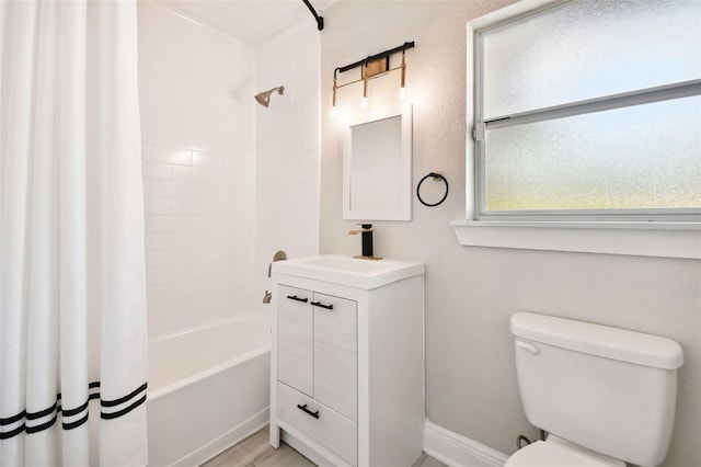 full bathroom featuring shower / tub combo with curtain, vanity, and toilet