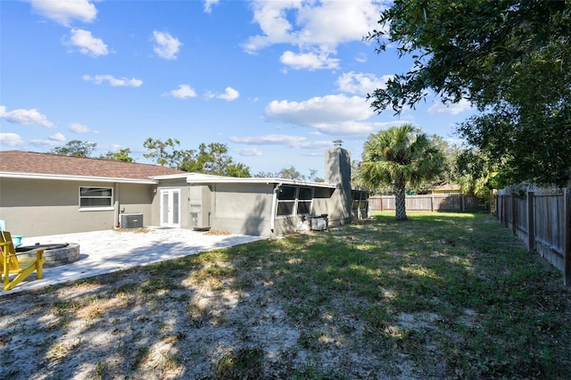 view of yard featuring a patio and central AC unit