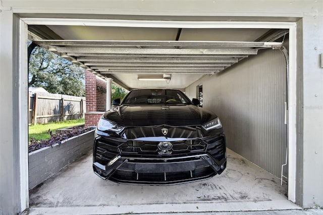 view of vehicle parking featuring a carport