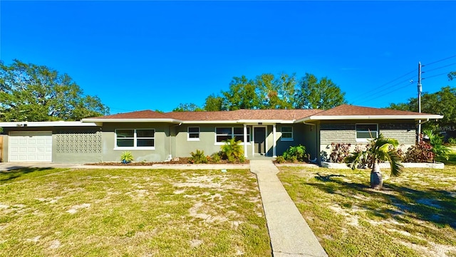 ranch-style home with a garage and a front yard