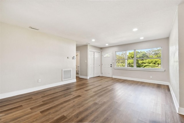 spare room featuring dark hardwood / wood-style floors