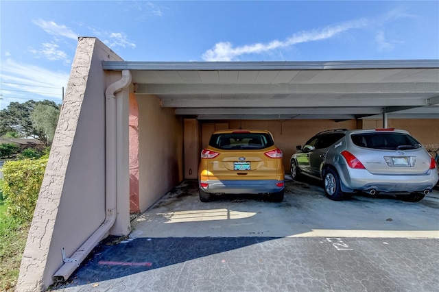 view of vehicle parking with a carport