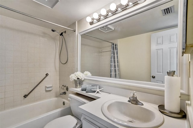 full bathroom featuring shower / bathtub combination with curtain, vanity, and toilet