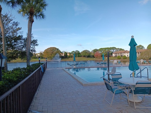 view of swimming pool with a patio area