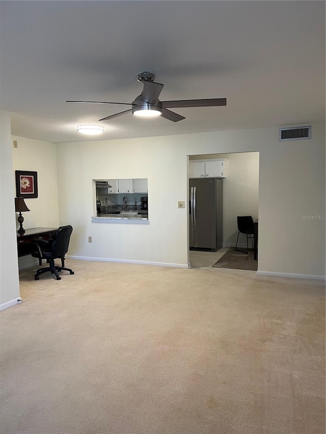 interior space featuring ceiling fan