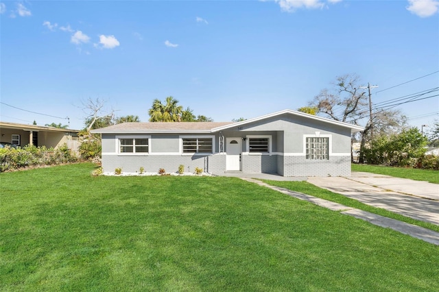 ranch-style home with a front lawn