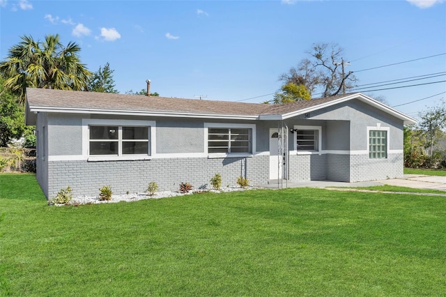 ranch-style home with a front yard