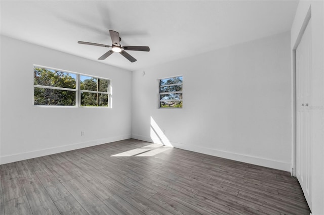 unfurnished bedroom with ceiling fan and wood-type flooring