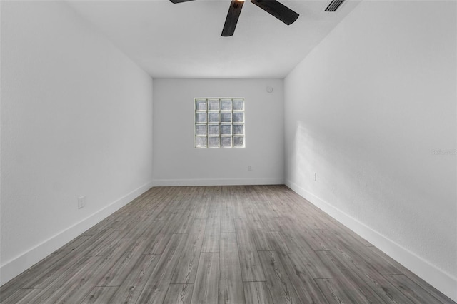 spare room featuring ceiling fan and light wood-type flooring