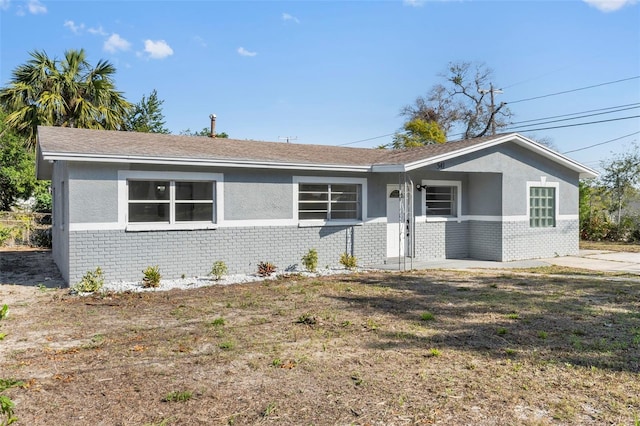 ranch-style home with a front yard