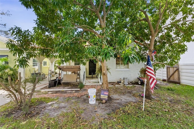 back of property with a patio area