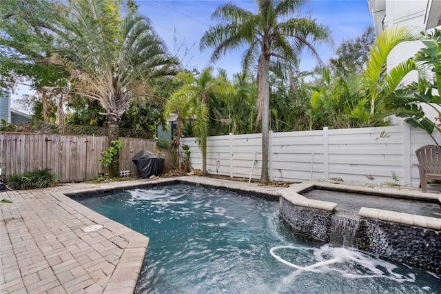 view of swimming pool with grilling area