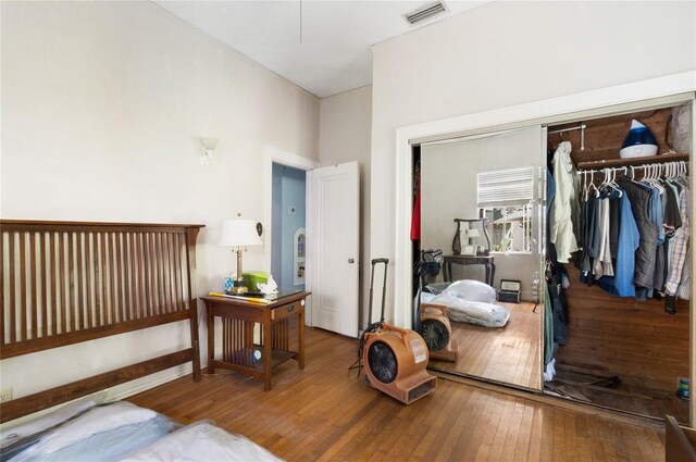 bedroom featuring a closet and hardwood / wood-style floors