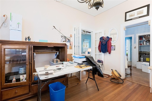 office with ceiling fan and hardwood / wood-style floors