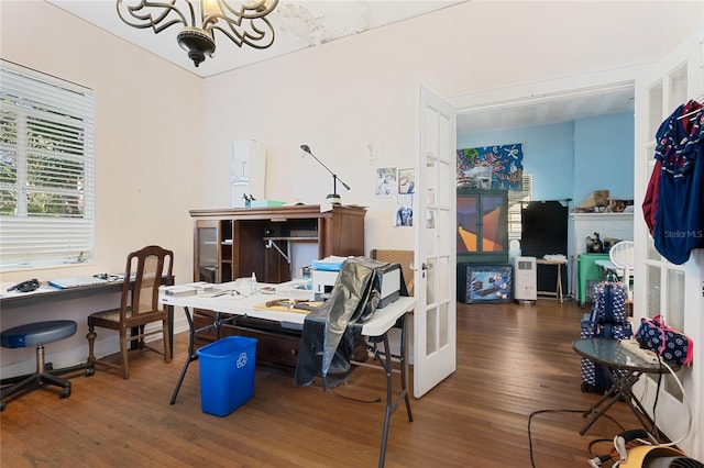 home office featuring an inviting chandelier and dark hardwood / wood-style flooring