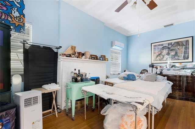 bedroom featuring hardwood / wood-style flooring and ceiling fan