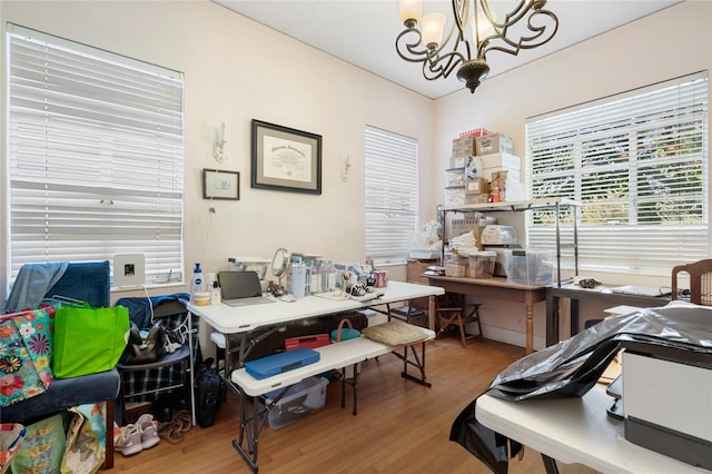 office area with hardwood / wood-style flooring and a chandelier